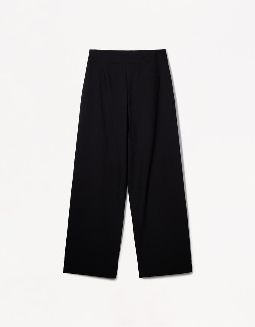 PLEATED BELTED TROUSERS