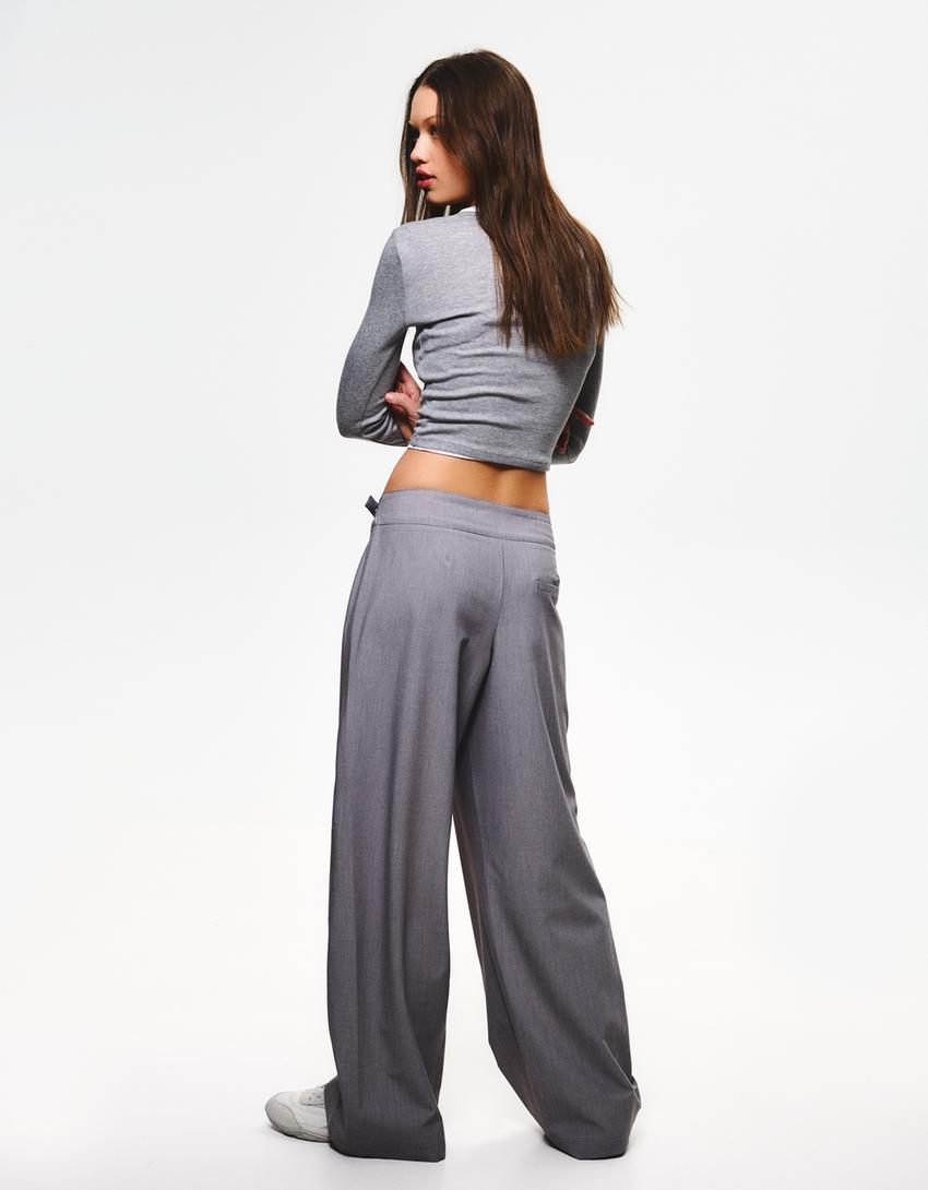 PLEATED BELTED TROUSERS